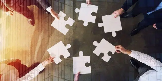 An Image of puzzle pieces coming together